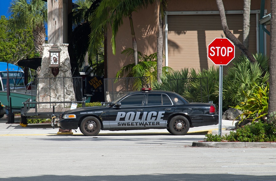 Sweetwater Police Department cruiser is pictured parked near a local shopping area on a sunny day.