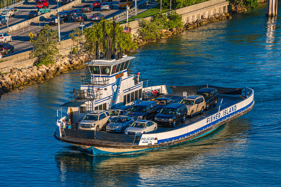 Fisher Island ferry transporting vehicles across Biscayne Bay, providing one of the primary access points to the private island community from Miami. 