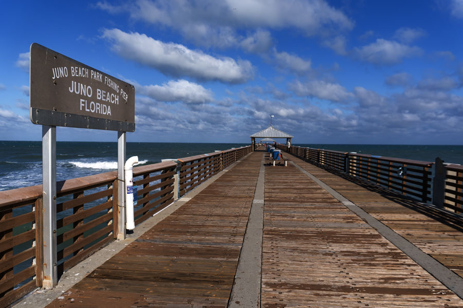 Juno Beach Fishing Pier extends into the Atlantic Ocean, offering scenic views, fishing access, and a classic coastal landmark experience along Florida’s shoreline.