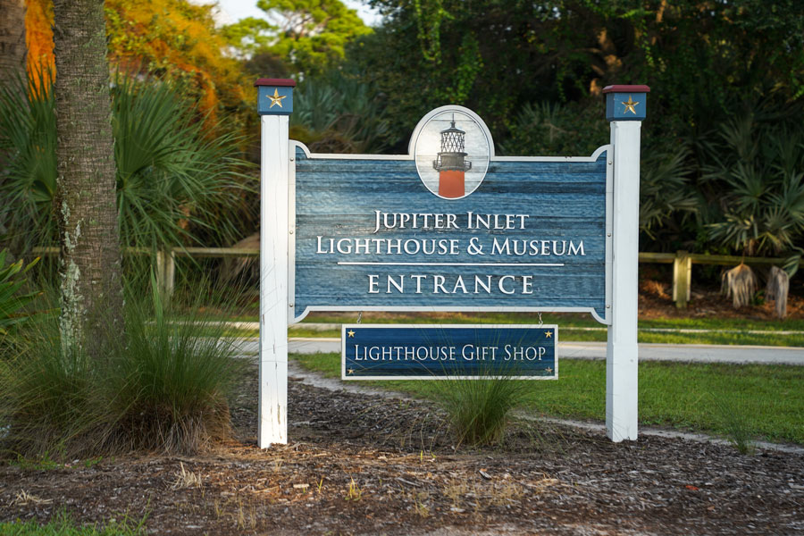 Entrance sign for the Jupiter Inlet Lighthouse & Museum in Jupiter, Florida, marking the historic site and visitor access point near the inlet and surrounding natural area.