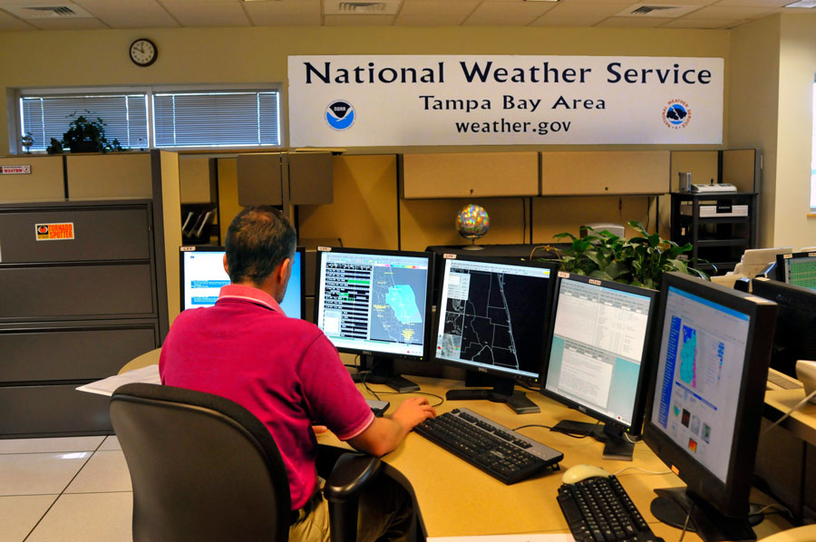 Meteorologist working at a NOAA National Weather Service station in Ruskin, Florida, monitoring radar and weather data for the Tampa Bay region. Photographed May 19, 2024.