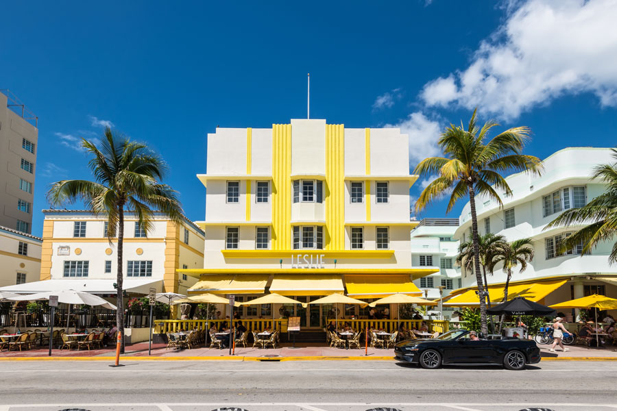 The Art Deco District in Miami Beach is one of South Florida's most recognizable landmarks, featuring colorful architecture, outdoor cafés, palm-lined streets, and a vibrant atmosphere. The district attracts visitors year-round for its history, dining, shopping, nightlife, and iconic South Beach setting. 