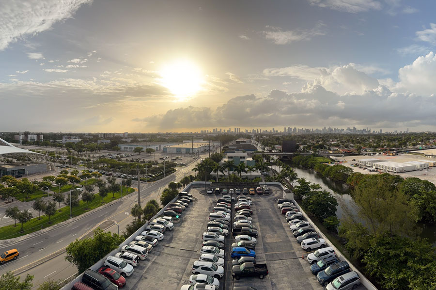An aerial view looking east from Miami International Airport toward central Miami, with the Flagami neighborhood located just beyond the airport. The view helps show Flagami’s central position between the airport, Little Havana, Downtown Miami, and surrounding Miami-Dade communities. 