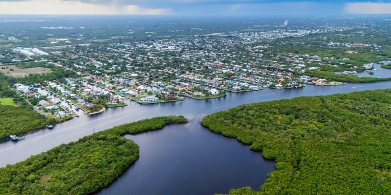 An aerial view of the Indian River Lagoon showcases one of the Treasure Coast's defining natural features, where winding waterways, mangrove forests, waterfront neighborhoods, and abundant wildlife create a landscape popular for boating, kayaking, fishing, and nature exploration.