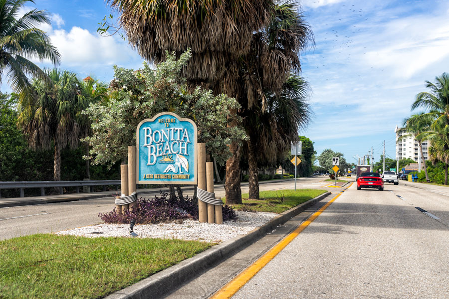 The Bonita Beach welcome sign marks the entrance to one of Southwest Florida's most popular Gulf Coast beach communities. Bonita Beach is known for its white-sand shoreline, warm Gulf waters, spectacular sunsets, and easy access to boating, fishing, shelling, and other outdoor recreation. Its relaxed coastal atmosphere has made the area a favorite destination for residents, seasonal visitors, and vacationers exploring the Bonita Springs region.