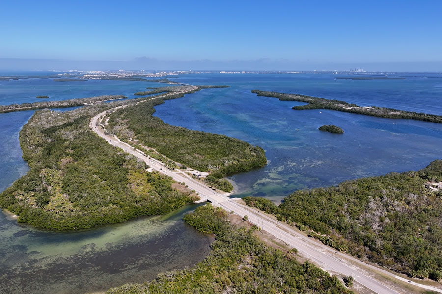 A panoramic view of Florida’s Gulf Coast reveals a landscape of mangrove-covered islands, shallow bays and protected coastal waterways. Scenes like this are common along portions of western Florida, where roads and bridges connect developed communities while large areas of estuary and natural shoreline continue to provide important habitat for marine life and coastal wildlife.