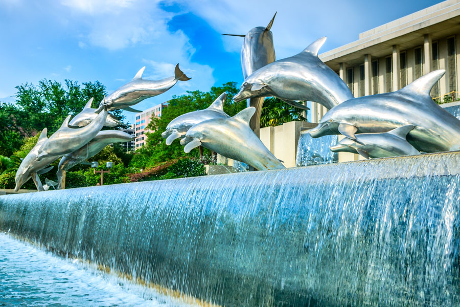 The Florida Heritage Fountain at Waller Park features a dramatic sculpture of dolphins and a marlin beside the Florida State Capitol in Tallahassee. The fountain adds a distinctly Florida theme to the landscaped Capitol complex, connecting the state’s seat of government with imagery inspired by its coastal waters and marine life.