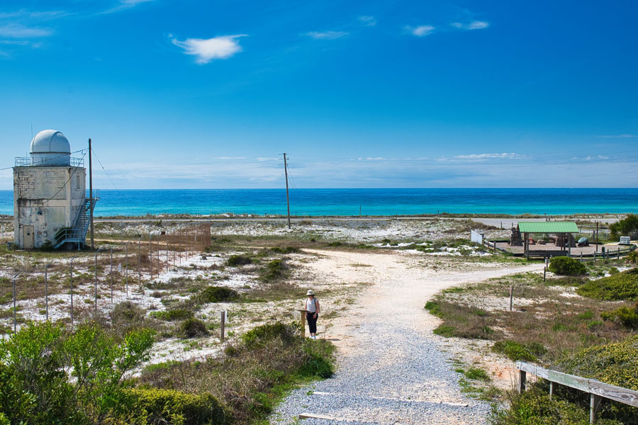 Henderson Beach State Park in Destin preserves a natural stretch of Florida’s Emerald Coast, with white-sand dunes, coastal vegetation and clear Gulf waters. The protected shoreline offers visitors opportunities for swimming, walking, wildlife viewing and experiencing the region’s coastal landscape away from the surrounding resort development. Photo credit: Erez Hazak; licensed.